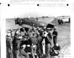 Chinese sergeants crowd around Sgt. Paul F. Brown as he conducts a class in ground repair. Instruction was via interpreter even though many of the Chinese sergeants speak English. In China during WWII.