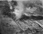 B-25s fly in front of Yishan (now Yizhou) in Guangxi province, SW China, among Karst peaks during the Japanese Ichigo campaign of summer and fall 1944. Towns along the Ichigo route were bombed by American planes as the Japanese moved into them, or sometimes in advance, to deny the resources of the towns to the incoming Japanese. The Japanese entered Yishan town on November 14, 1944, which should be the approximate date of this image. The Japanese stayed in Yishan until mid-June 1945, and allies bombed Yisha