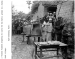 A funeral procession preparing to head out for burial ground in a Burma Road Chinese village during WWII.  In the CBI.   Photo by Syd Greenberg.