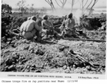 Chinese troops fire on Japanese positions near Bhamo, Burma, on December 13, 1944.  US Army Photo, from Raimon B. Cary.