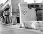 Street in Chandannagar , India, with ornate post labelled "Chandernagor."  Photo from George Bottoms.