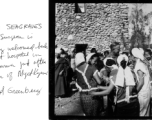 Dr. Gordon Seagrave receives joyful welcome at his bombed out hospital in Namhkan, Burma, after the surrender of Myitkyina.  Photo by Syd Greenberg.