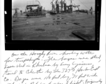 "On the Hooghly River hauling water for troop ships. The barges were steel, assembled in Khulna by Army Engineers, towed to Calcutta by the 327th Harbor Craft Co. Barges were 110 feet long, 31 feet wide, with about 7 feet of free board light. Originally used to haul gasoline from Goalindo to Dacca by the 327th and the 326th. Left to right: Weingarten (San Pedro, California), Smith (Tenn.), Eugene Bowers ? (Deepwater, New Jersey), Dillworth ?, and at the controls of the Catamaran Lynn? from Great Falls, Mont