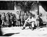 School kids in the school courtyard, with Fred Nash, 10 miles east of Yangkai, Spring of 1945.  From the collection of Frank Bates.