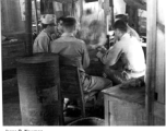 GIs play a card game in the barracks in the CBI during WWII.  Photo from Jesse D. Newman.