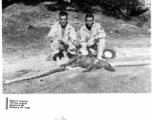 GIs in the CBI pose with a snake that ate a large mammal.  Photo from Albert E. Freeman.