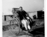 A rickshaw puller in China resting. During WWII.