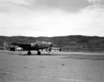 B-25 tail number 435 above a runway in Yunnan, likely Yangkai.  From the collection of Wozniak, combat photographer for the 491st Bomb Squadron, in the CBI.