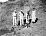 Base personnel inspect a water pump near an American base in Yunnan Province, China, during WWII.