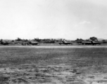 A row of P-51s in the CBI.  From the collection of Wozniak, combat photographer for the 491st Bomb Squadron, in the CBI.