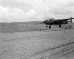 B-25, tail number 435, of the Ringer Squadron, above a runway in Yunnan. During WWII.