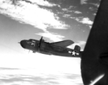 "Joyce Marie", a B-25H of the 491st Bomb Squadron, flies in formation somewhere in the CBI.  From the collection of Eugene Wozniak.