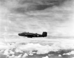 This unidentified B-25C has its bomb bay doors open as the formation approaches a target somewhere in Burma.  From the collection of Wozniak, combat photographer for the 491st Bomb Squadron, in the CBI.