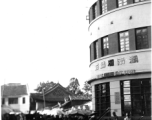 Local people in in Kunming city, Yunnan province, China: A market area and the "Hunan Embroidery Store" during WWII.