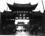 The Golden Horse 金马 archway in Kunming, and the other of the pair, the Emerald Rooster Archway (金马碧鸡坊), in the distance.  In the CBI during WWII.