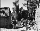 Local people in China: People on a path in a village in Yunnan, China, during WWII.  From the collection of Eugene T. Wozniak.