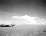 B-25 Mitchell bomber #439 in flight in the CBI, in the area of southern China, Indochina, or Burma.