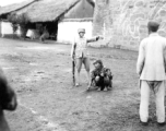 A beggar and a soldier, China, during WWII.  From the collection of Wozniak, combat photographer for the 491st Bomb Squadron, in the CBI.