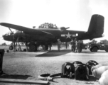 A B-25 under maintenance in the CBI during WWII. Notice the canvas cover over the turret on the fuselage.  From the collection of combat photographer Eugene T. Wozniak, 491st Bomb Squadron.