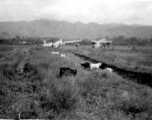 "This Is A View Of Our Salvage Area At Liangshan,China. The Goats In The Picture Were A Problem And Almost Got Ralph O'Connor Court Martialed."