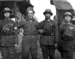 An American GI and Chinese military police pose for the camera: "This Is A Picture Of Nick Vassello And Some Of China's Finest Soldiers."