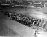 Chinese laborers pull a large concrete roller at an American base in Guangxi, China, during WWII.