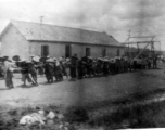 Chinese laborers pull a heavy concrete roller at an American base in China during WWII: "All the runways in China were made of crushed stone. They started the base with the larger stone and each layer that was added was of a smaller stone. The final layer of the runway surface was was made of finely crushed stone that was rolled and rerolled by Chinese coolies pulling a huge stone roller as shown in this picture. One of the big problems with our runways was the larger stone kept working their way to the sur