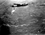 Smoke rises on the ground, behind B-25 #437 after an attack by American B-25s in either SW China, Indochina, or the Burma area.  This might be fairly close to Tengchong in China.