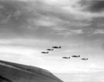 B-25 Mitchell bombers in flight in the CBI, in the area of southern China, Indochina, or Burma.  This image itself is probably taken from within a B-25, from the machine gun turret in the top of the fuselage.