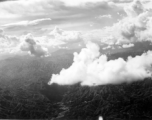 B-25 Mitchell bombers in flight over mountains in the CBI during WWII.