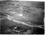 Smoke rises on the ground after an attack by American B-25s in either SW China, Indochina, or the Burma area.  This might be fairly close to Tengchong in China.