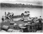 Shipping bombs and fuel by boat and hard human labor, near Lingling. During WWII.  From the collection of Hal Geer.