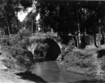 A small arched stone bridge near Kunming. During WWII.