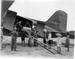 Unloading (or loading) fuel barrels from C-47 transport plane #315380 in China during WWII. Note how some of the Chinese laborers are just teenagers, and overshadowed by the much larger adult American soldiers.