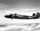 A B-25 bomber, tail #449, of the 491st Bombardment Squadron in flight on a mission.  From the collection of Frank Bates.