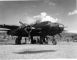 B-25 and crew at Yangkai, late 1944? Looks like 436 (same as large group picture) just coming in new to the squadron.  The big guy kneeling (in silhouette) with the cap brim up is A.B. Christensen.  From the collection of Frank Bates.