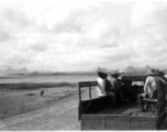 Chinese workers riding transport on the US air base at Liuzhou. During WWII.  From the collection of Frank Bates.