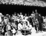 Restaurant 10 miles east of Yangkai, Spring 1945.  Clayton E. "Fred" Nash, holding carbine, does not quite blend in.