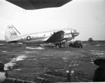 The C-46 transport tail #347391 parked at the American base at Luliang, China. The control tower can be seen in the background. During WWII.