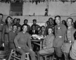 Table of local ranking Nationalist leadership during the banquet at the rally. In foreground, left, is Chinese Lt. General Du Yuming, commander of Nationalist 5th Corps (第五集团军总司令兼昆明防守司令杜聿明). Sitting turned, on right, is Gen. Wei Lihuang (卫立煌). Standing on far right is Zheng Tingji (郑庭笈), commander of the 48th Army Division (陆军第四十八师 ).  The general seated on the far left is Qiu Qingquan (邱清泉).  The two civilians seated in the back are KMT civilian officials. The one on the right is likely An Zefa (安则法), a hi