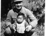 A Chinese Nationalist soldier, surname Li (李), and child in China during WWII. This was not a random family and Wozniak knew them, as another image in the collection show this image tacked to a wall in a home--a gift from Wozniak to the family.