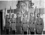 Banner bearers for different regiments of the 48th Army Division stand during rally, with 48th Army Division Zheng Tingji (郑庭笈), commander of the 48th Army Division holding the staff of the division banner. Left of him--the only person not holding a staff--is Chinese Lt. General Du Yuming, commander of Nationalist 5th Corps (第五集团军总司令兼昆明防守司令杜聿明).