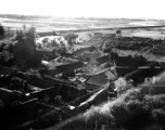 A village as seen from a B-25 flying at extremely low and dangerous treetop level in French Indochina. During WWII.