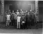 A group of local soldiers--likely a local militia or local KMT-affiliated warlord soldiers--in Yunnan, China, during WWII. They are standing before a temple.