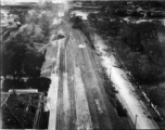 Large crater and tracks shifted wholesale during bombing on Phu Lang Thuong railway bridge over the Thuong River at Bắc Giang City in French Indochina (Vietnam), during WWII. In northern Vietnam, and along a critical rail route used by the Japanese.  Coordinates:  21°16'32.69"N 106°11'9.28"E  The low level that these B-25 crews flew at times is truly remarkable, as evidenced in this image.