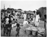 Busy market scene.  Scenes in India witnessed by American GIs during WWII. For many Americans of that era, with their limited experience traveling, the everyday sights and sounds overseas were new, intriguing, and photo worthy.