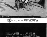 Rickshaw puller poses with his customer, Cpl. William C. Burwinkel.  Yunnan Province on December 13, 1944.  Photo by T/5 John B. Hendrick.  Passed by William E. Whitten.