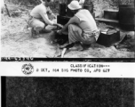 T/4 Kendrick M. Hemingway, cook for the BRE in the Kao district, si seen taking a pie out of a stove in the field.  December 2, 1944.  Photo by T/5 Milton Koff. 164th Signal Photographic Company, APO 627.