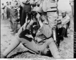 Two Chinese officer students of the General Staff School, near Kunming, China, observing the effect of mortar fire on distant target during a demonstration of infantry weapons.  June 5, 1945.  Photo by Pfc. Seymour Israel. 164th Signal Photographic Company, APO 627.