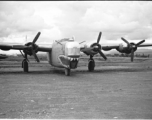 The Consolidated B-24 bomber "Nip Nipper," serial #42-72837. This is later in the war, and the B-24 has been modified to carry cargo, with the nose guns (and much more) removed.